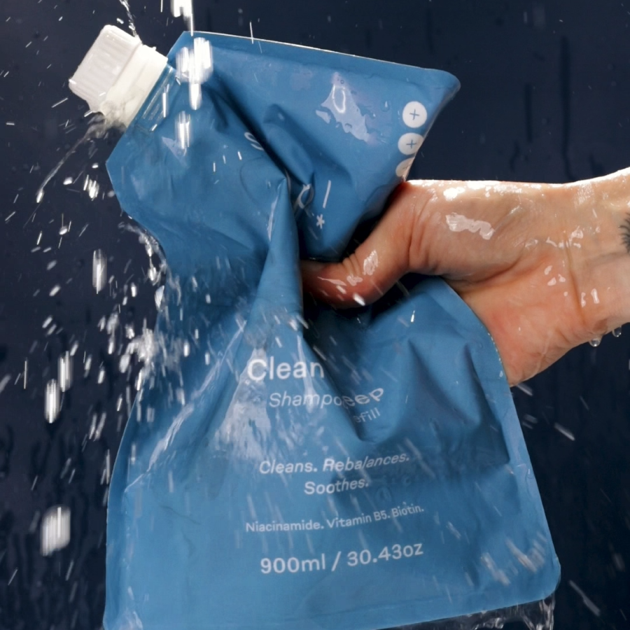 skelp refill shampoo hand squeezing eco friendly packaging in shower