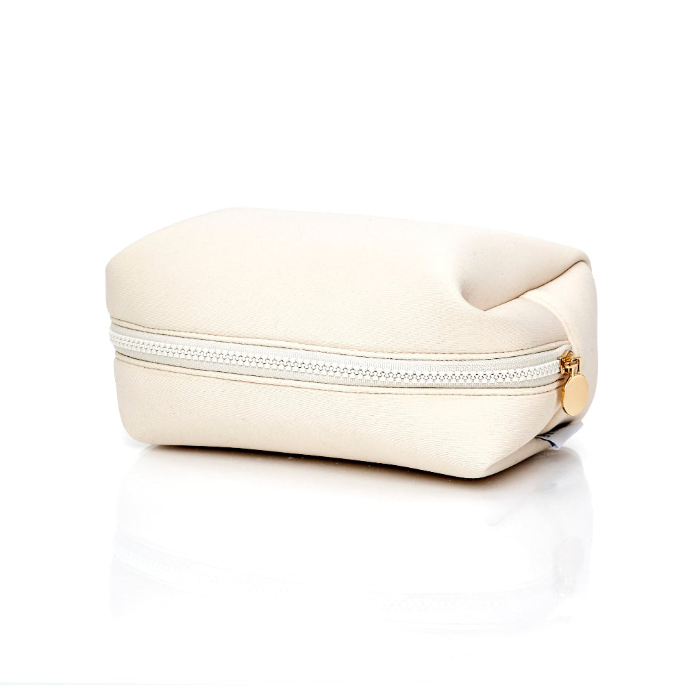 travel cosmetic bag for hair and makeup. Cream neoprene with gold detail.