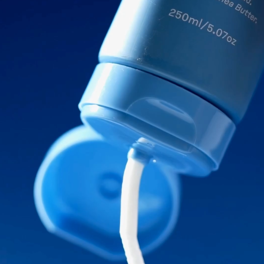 Skelp Hair Mask product that Strengthens strands being squeezed out of bottle