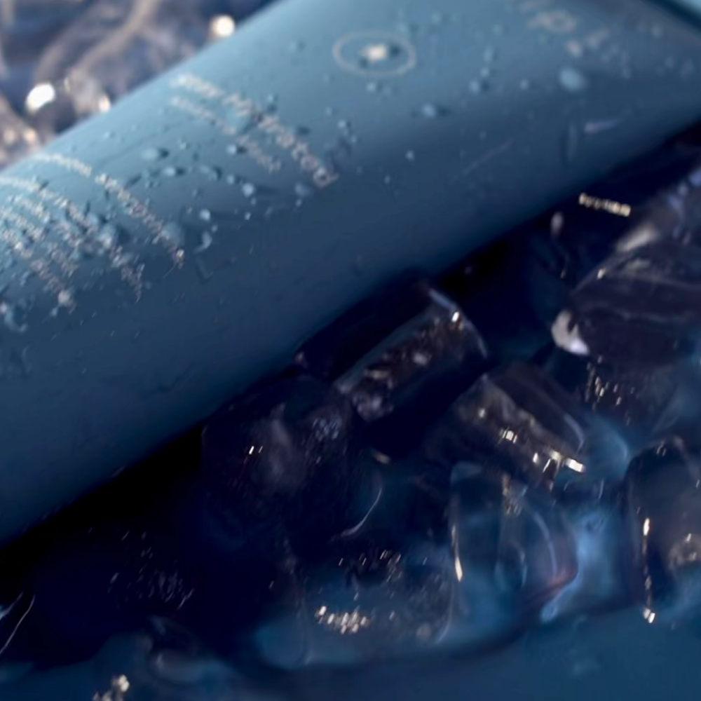 Skelp hair mask with water droplets on it