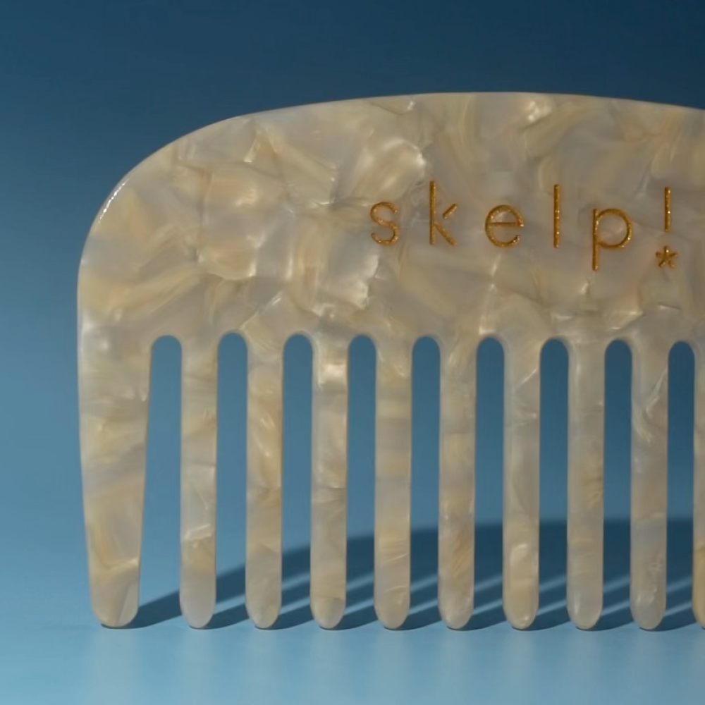 macro shot of premium marble wide tooth comb for detangling wet or dry hair