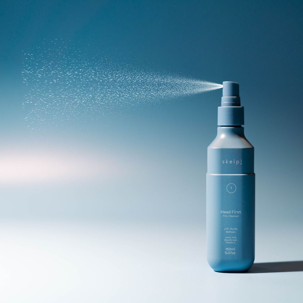 skelp! best seller Head First Pre Cleanser - blue background mist spraying